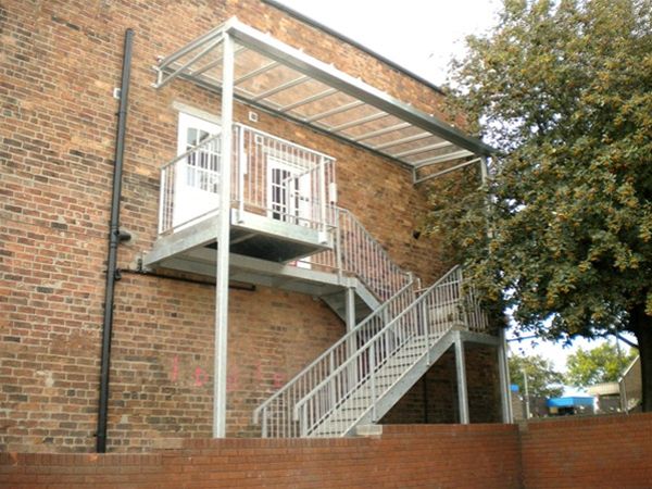 PM09 Fabricated External Staircase with Integral Glazed Canopy Unit